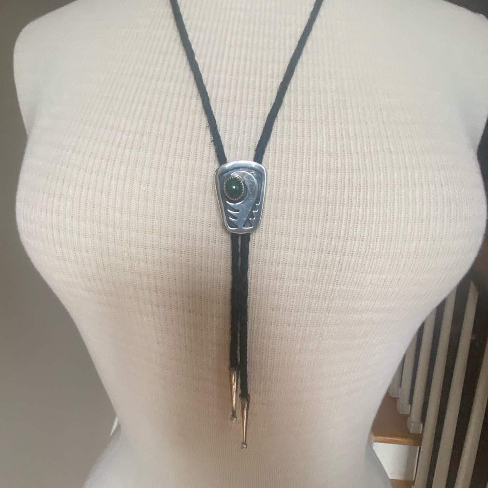 Elegant Sterling Silver Bolo Tie with leather ties also tipped with silver